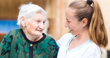 Senior woman smiling with her nurse