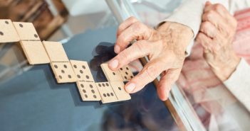 Old woman playing domino games